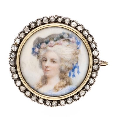 Round miniature brooch GG 750/000 and 333/000, unstamped, hallmarked, set with a round 