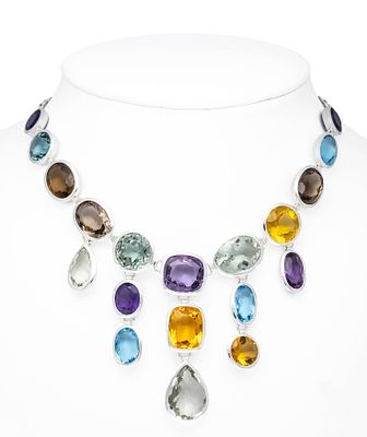Cocktail necklace in silver with variously shaped faceted gemstones of different colors 