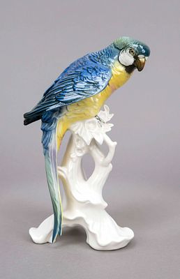 Parrot sitting on a branch, Ens, 20th century, polychrome, H. 24 cm