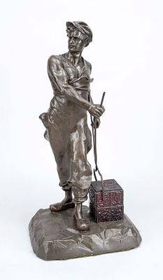Unknown sculptor, circa 1920, figurative lamp depicting a steelworker holding a glowing cube 