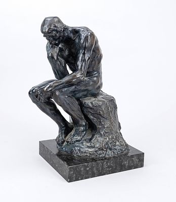 Auguste Rodin (1840–1917), after, “The Thinker,” mass-cast, finished in black-blue, on a marble 