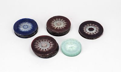 Assortment of glass elements resembling bull’s-eye panes, 19th–early 20th century, each with 