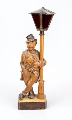 Figurative table lamp, early 20th century. Carved wood, painted or stained. Square pedestal 
