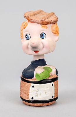 Bobbing-head piggy banks, mid-20th century. Polychrome ceramic. Man standing in a barrel 