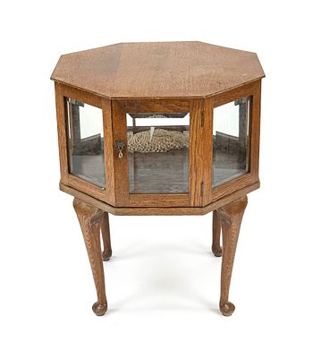 Octagonal tea table, circa 1930, oak, honeycomb-shaped, faceted on all sides, glass-fronted 