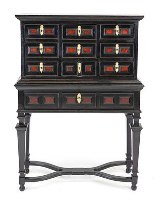 Small cabinet, probably 18th century, ebonized hardwood, body standing on studded feet with 