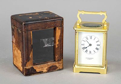 English travel clock in leather case, indistinctly signed on the dial, circa 1905, with 