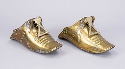 Pair of stirrup shoes, South America, 19th cent., brass. Solid hinge loops at top. Signs of use 