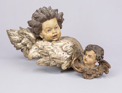 2 putti with angel heads, 1st half of the 20th century, wood carved, partly polychrome or 