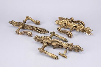 3 similar Gr&uuml;nderzeit door handle sets, 2nd half of the 19th century, brass. Elegantly curved 