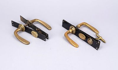 2 door sets, late 19th century, bronze, brass, iron. Straight iron plates, black lacquered. 