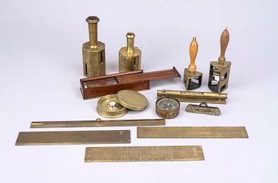 Collection of surveying instruments, 19th century, brass, wood, glass, etc. Includes 4 rulers 