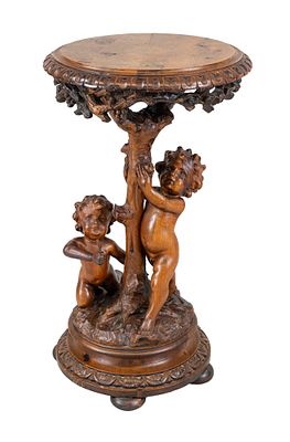 Decorative figurative side table, 19th century, softwood stained walnut, round top, the base 