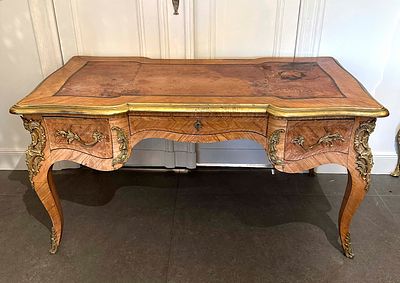 Bureau plat, France, late 18th century, walnut and various precious woods veneered, bronze 
