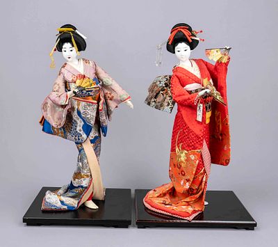 2 geisha dolls, probably Japan, 20th century, plastic and fabric. Each mounted on a 