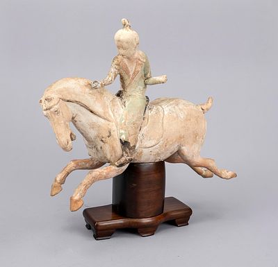 Galloping horse with rider in Tang style, China, exact age uncertain. Terracotta, partially 