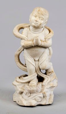 Figure of a boy, China, 20th century, marble. Standing on a rock plinth, chipped, H. 65 cm