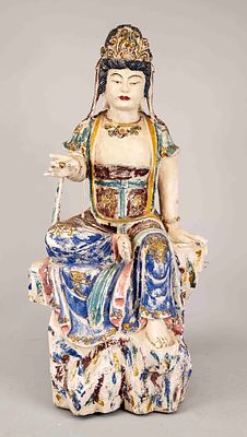 Guanyin on a rock base, China, 20th century, wood mounted and polychromatic decoration, chipped 