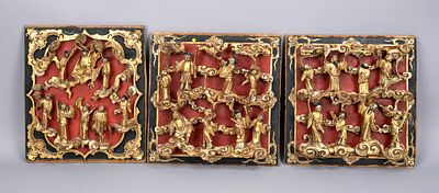 3 carved panels (from furniture), China, c. 1900 (Qing), wood with black and red lacquer 