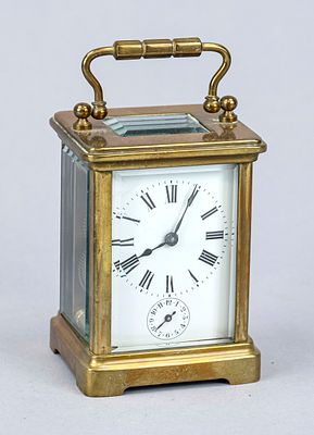 Travel alarm clock, France, circa 1900, gold-plated case, gold-plated clasp, faceted glass on 