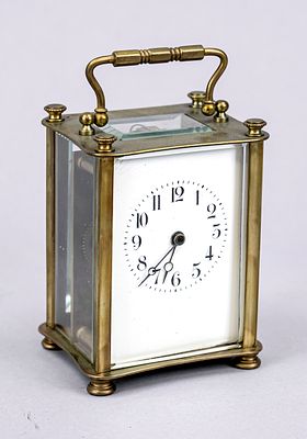 Travel alarm clock, brass, circa 1900, faceted glass on all sides, right pane with chip 
