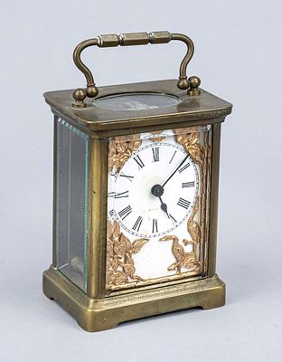 Art Nouveau travel clock, circa 1900, brass case, faceted glass on all sides, top-mounted crown 