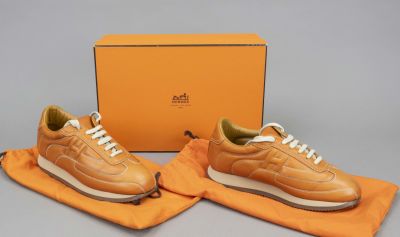 Hermes, sneaker, orange leather with white contrasting decorative stitching and other materials 