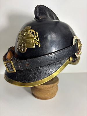 Saxon Fire Helmet for a Hose Team
G.A. Sch&ouml;ne, Dresden, circa 1900. Rare and well-preserved fire 