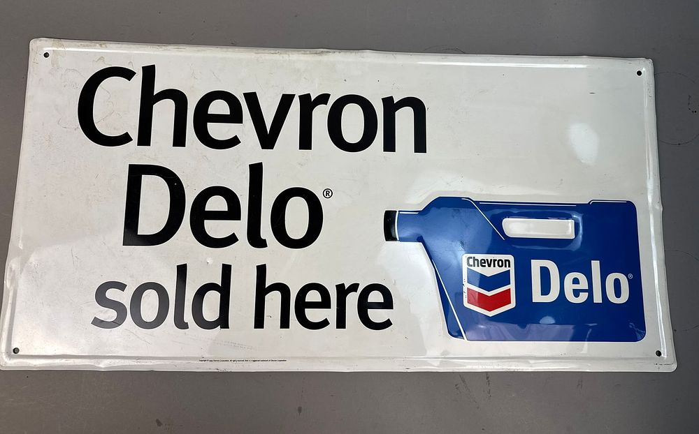 Lot 176: Chevron Delo Oil Embossed Metal Advertising Sign