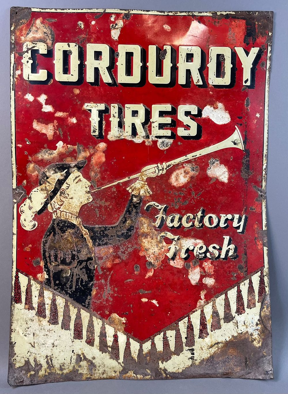 Lot 208: 1920s Cordoroy Tires Embossed Tin Advertising Sign