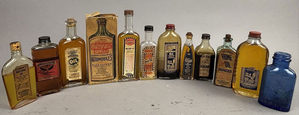 Lot 290: Lot 12 Glass & Paper Label Antique Machine Oil Bottles
