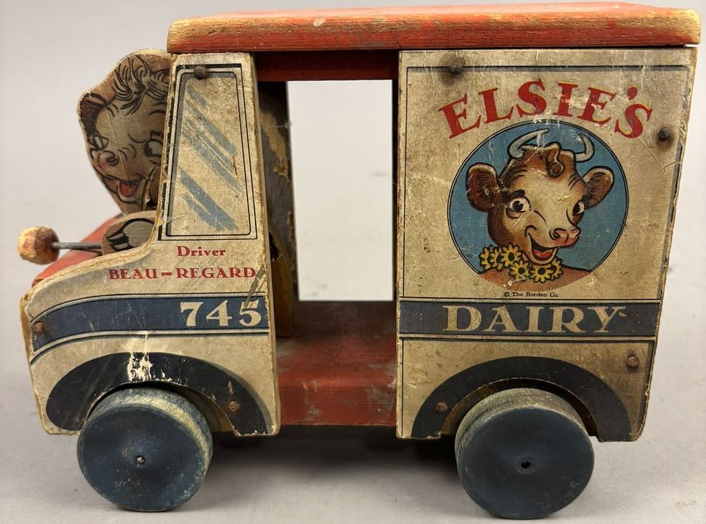 Lot 299: Elsie's Dairy Beau Regard Driver 40s Fisher Price Pull Toy