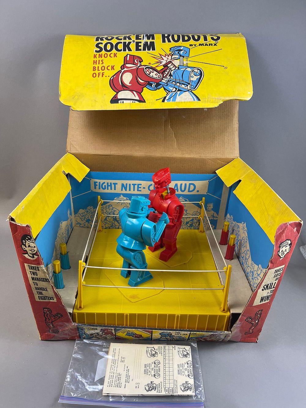 Lot 361: NOS 60s Rock Em Sock Em by Marx Fight Nite Game