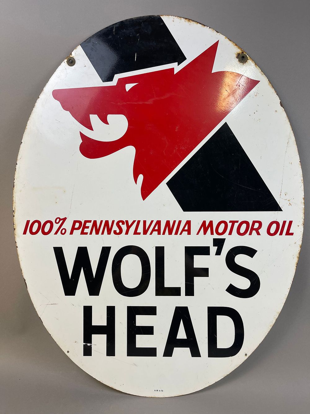 Lot 375: 1970 Wolf's Head DST Motor Oil Advertising Tin Sign