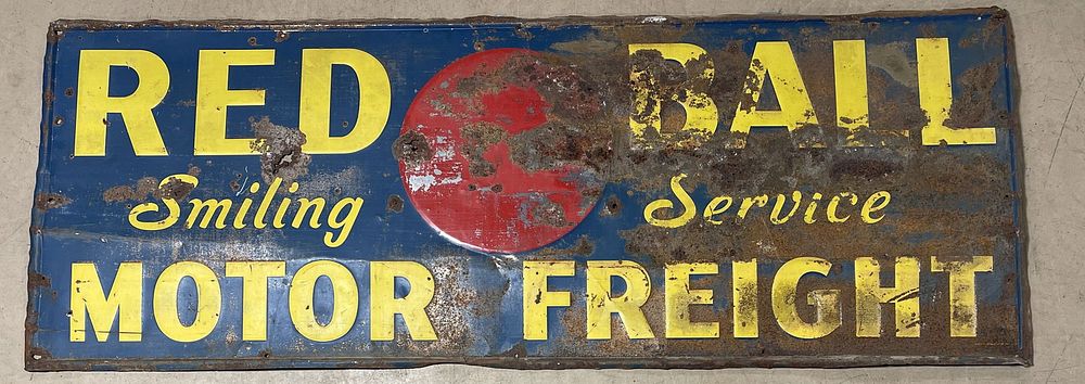 Lot 380: Red Ball Smiling Service Motor Freight 8' Embossed Tin Sign