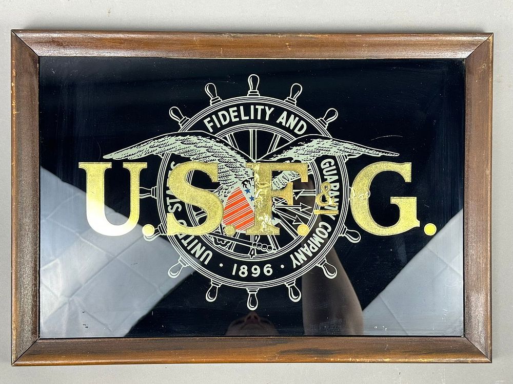 Lot 411: USFG United States Fidelty Guarantee Reverse Painted Sign
