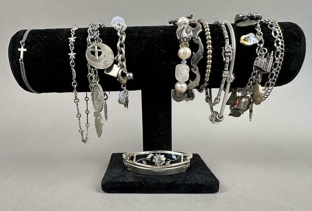 Lot 201: 13 Vintage Sterling Silver Charm Braclets 180 Grams