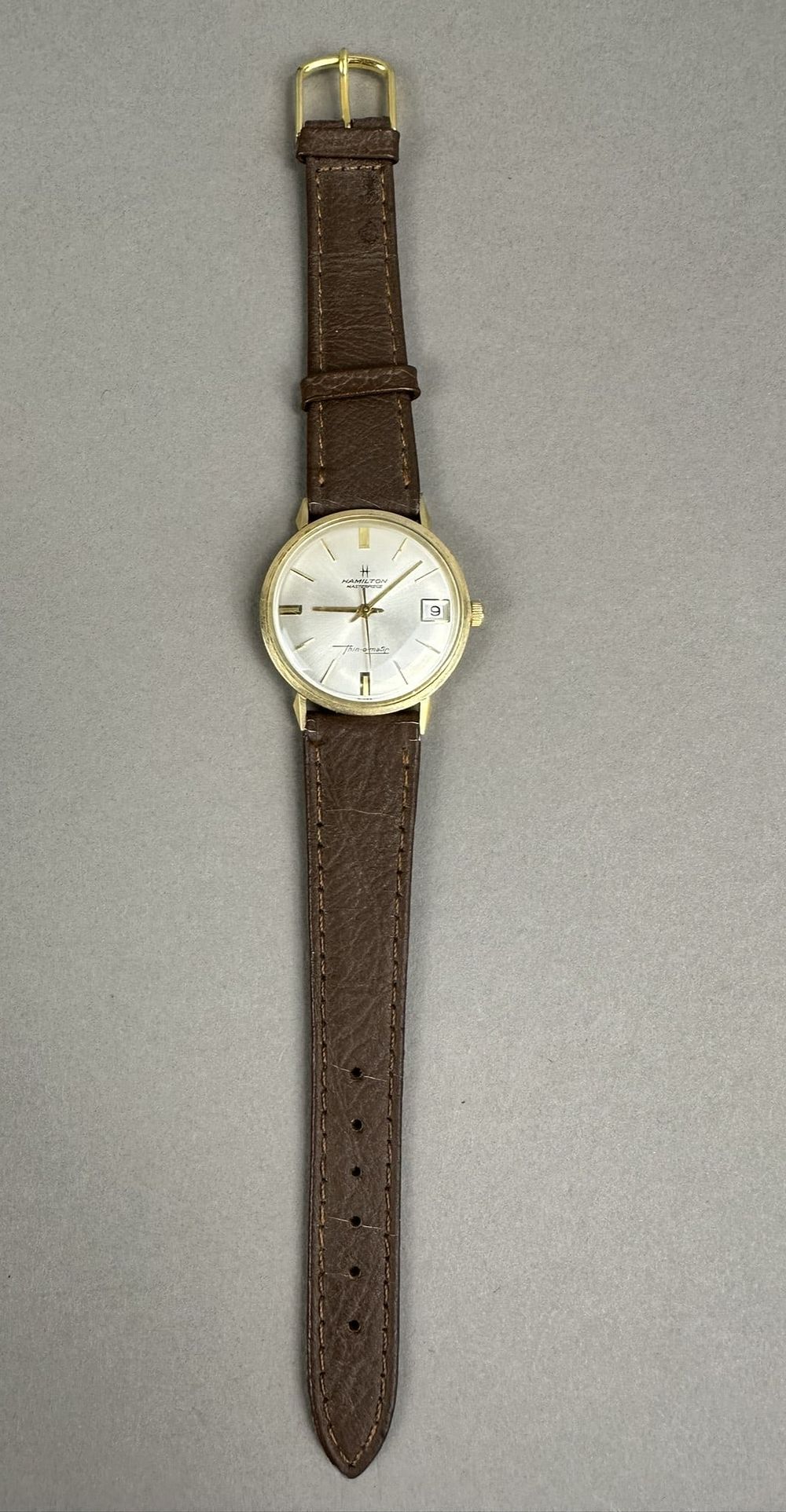 Lot 221: 10K Gold Hamilton Masterpiece ThinOMatic Mens Watch