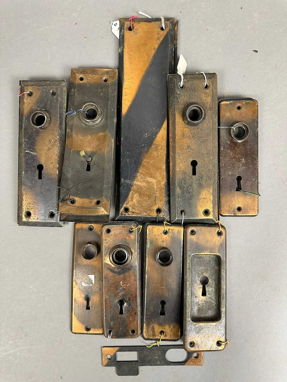 Lot 276: 17 Piece Antique Japaned Finish Brass Door Lock Plates 8 Matching Pairs