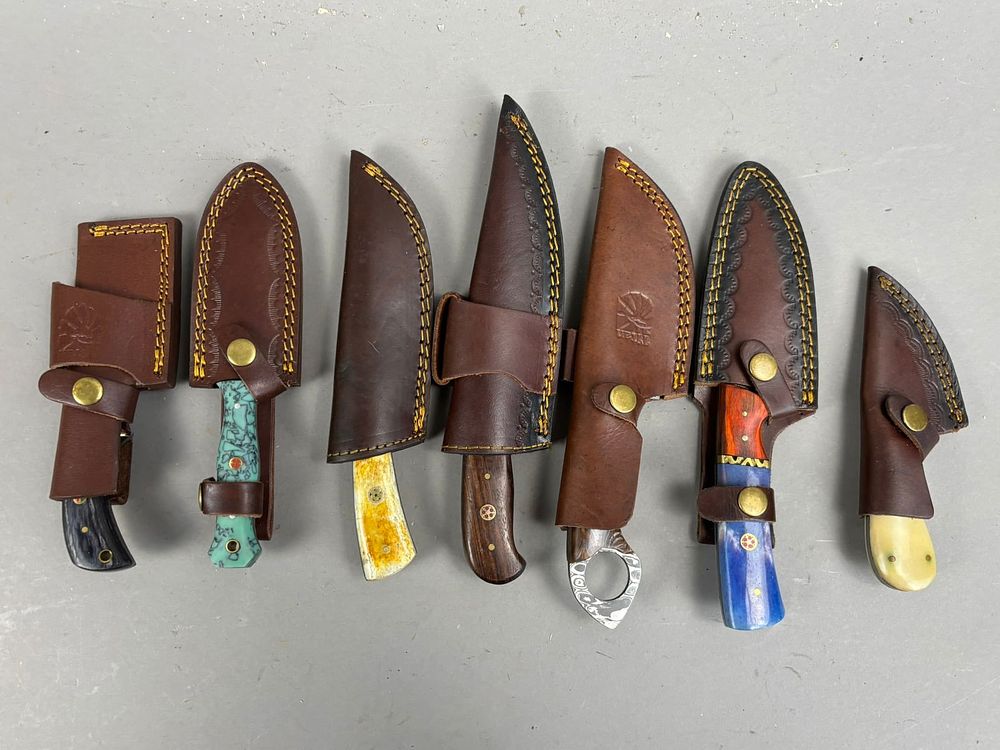 Lot 201: 7 Vintage Hunting Knives Damascus Blades Sheaths