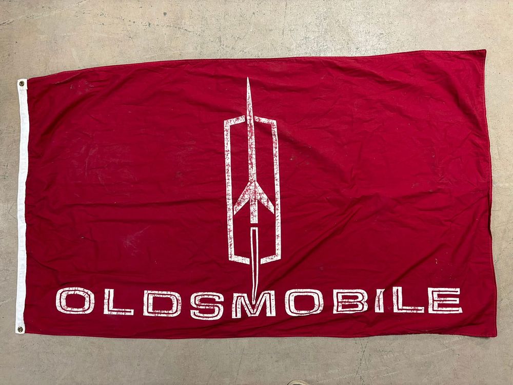 Lot 207: 60s Oldsmobile Dealer Advertising Canvas Banner