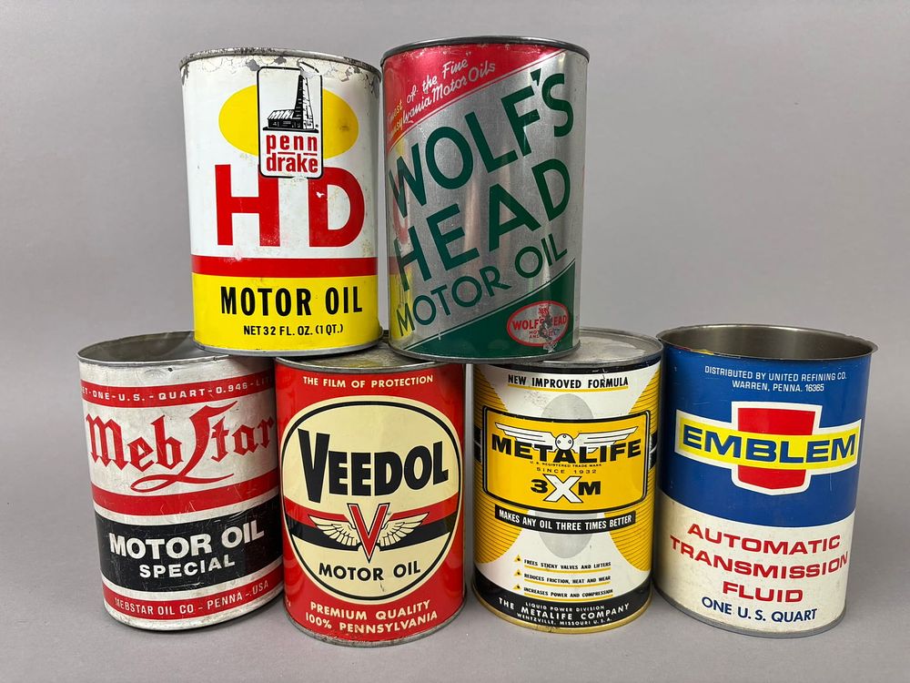 Lot 209: 6 Veedol Metalife Penn Drake Wolfs Head Oil Cans
