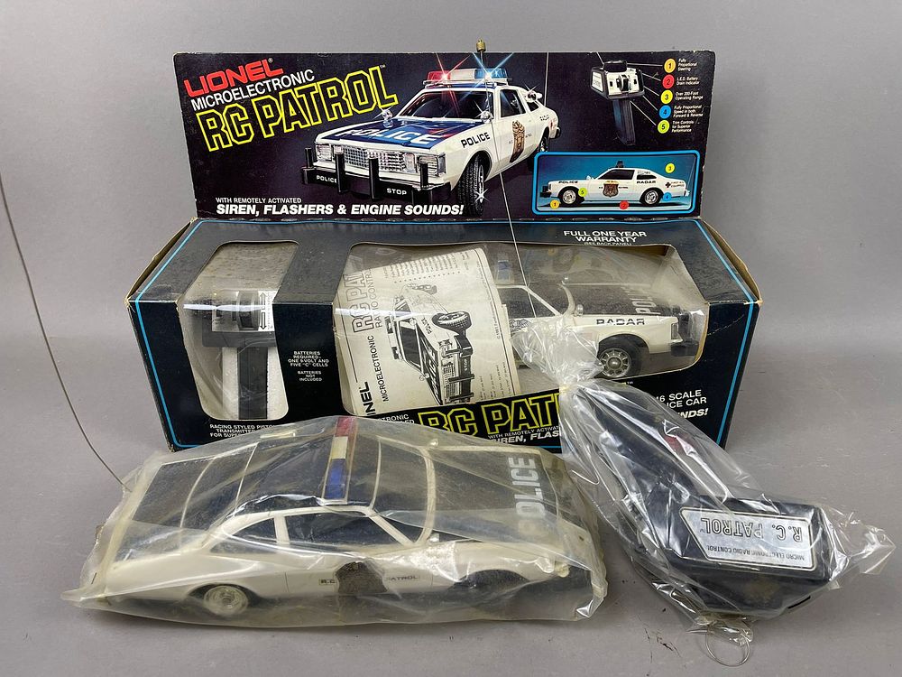 Lot 161: 2 NOS Lionel Police Cruiser Remote Control Toys