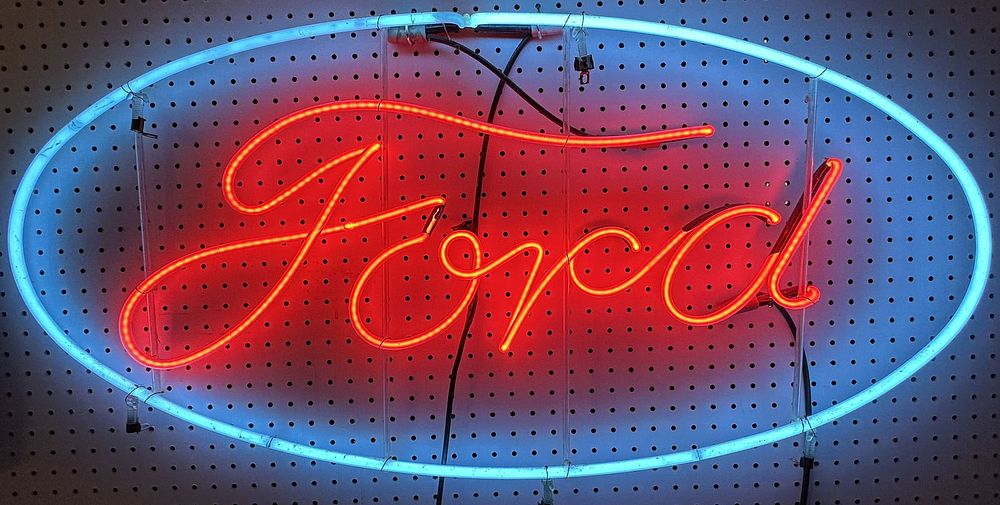 Lot 191: Ford Script 1940s Original 45" Oval Hanging Window Service Station Sign