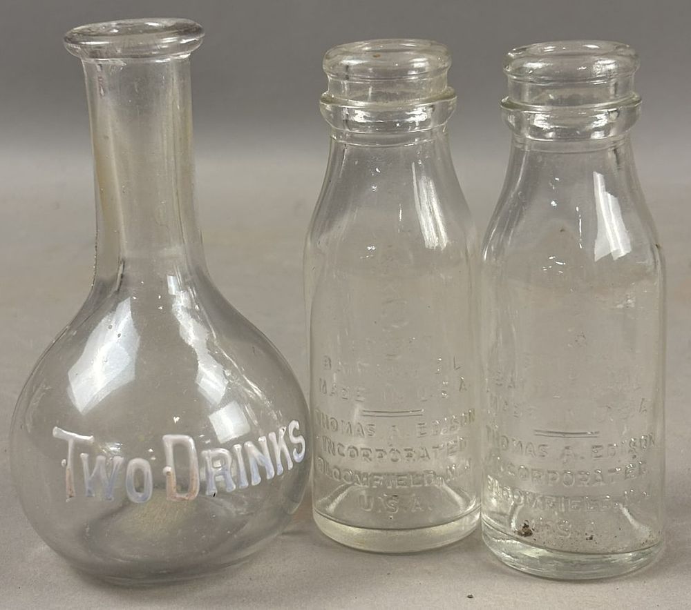 Lot 242: Two Drinks Embossed Small Whiskey Decanter & Pair Edison Oil  Bottles