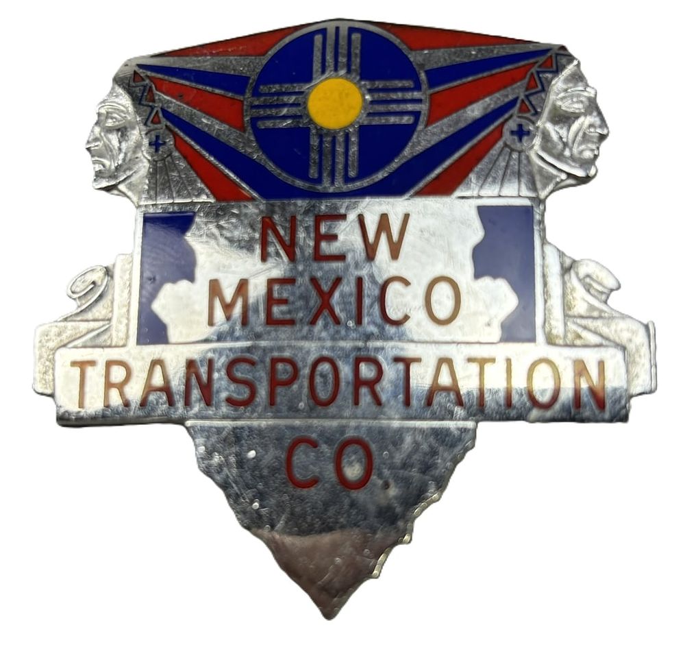 Lot 283: New Mexico Transportation Co Enamel Hat Badge w/ Native American Indians