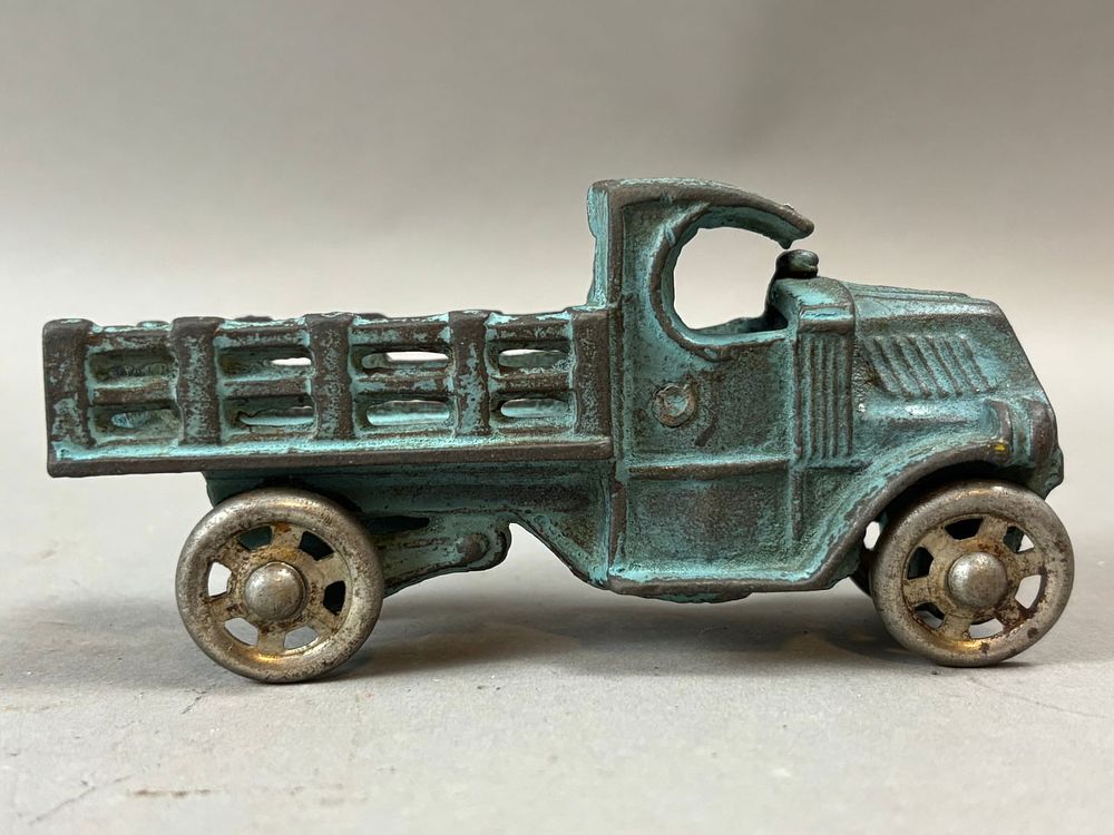 Lot 237: Antique Cast Iron Original Blue Painted Stake Bed Truck 4.75"