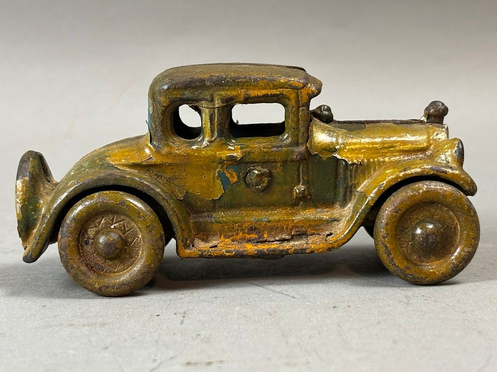 Lot 243: Original 1920s 4" Cast Iron 6 Window 2 Door Coupe Toy Car