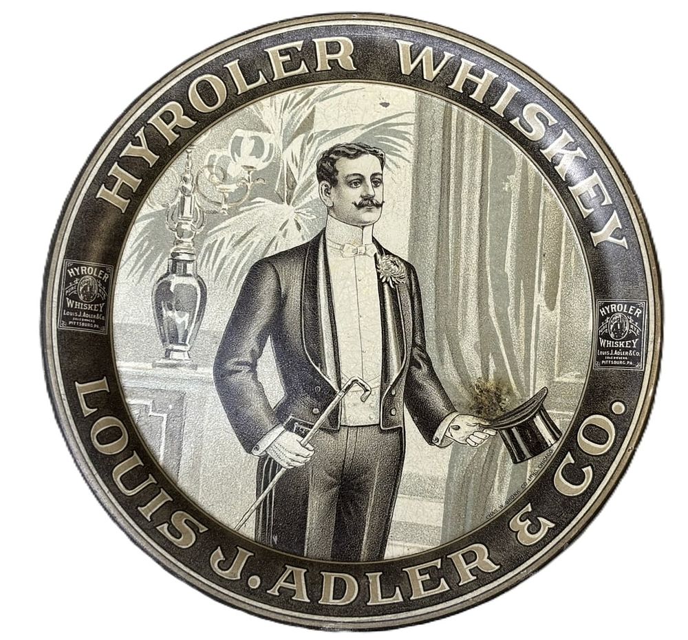 Lot 314E: Hyroler Whiskey Louis J Adler & Co Tin Litho Tip Tray by Chas Shonk
