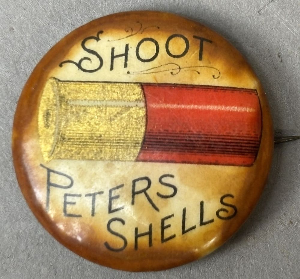 Lot 315J: Shoot Peters Shells Original 20s Celluloid Pinback Button